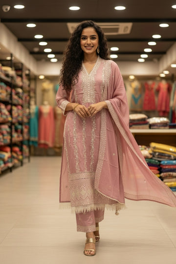 Pastel peach embroidered cotton suit set with dupatta, featuring delicate floral embroidery on the kurta and matching