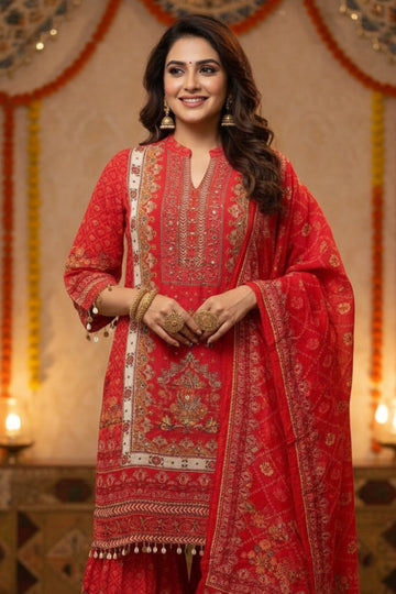 Elegant Scarlet Red Ethnic Suit Set with Sharara & Dupatta. A woman models the outfit.