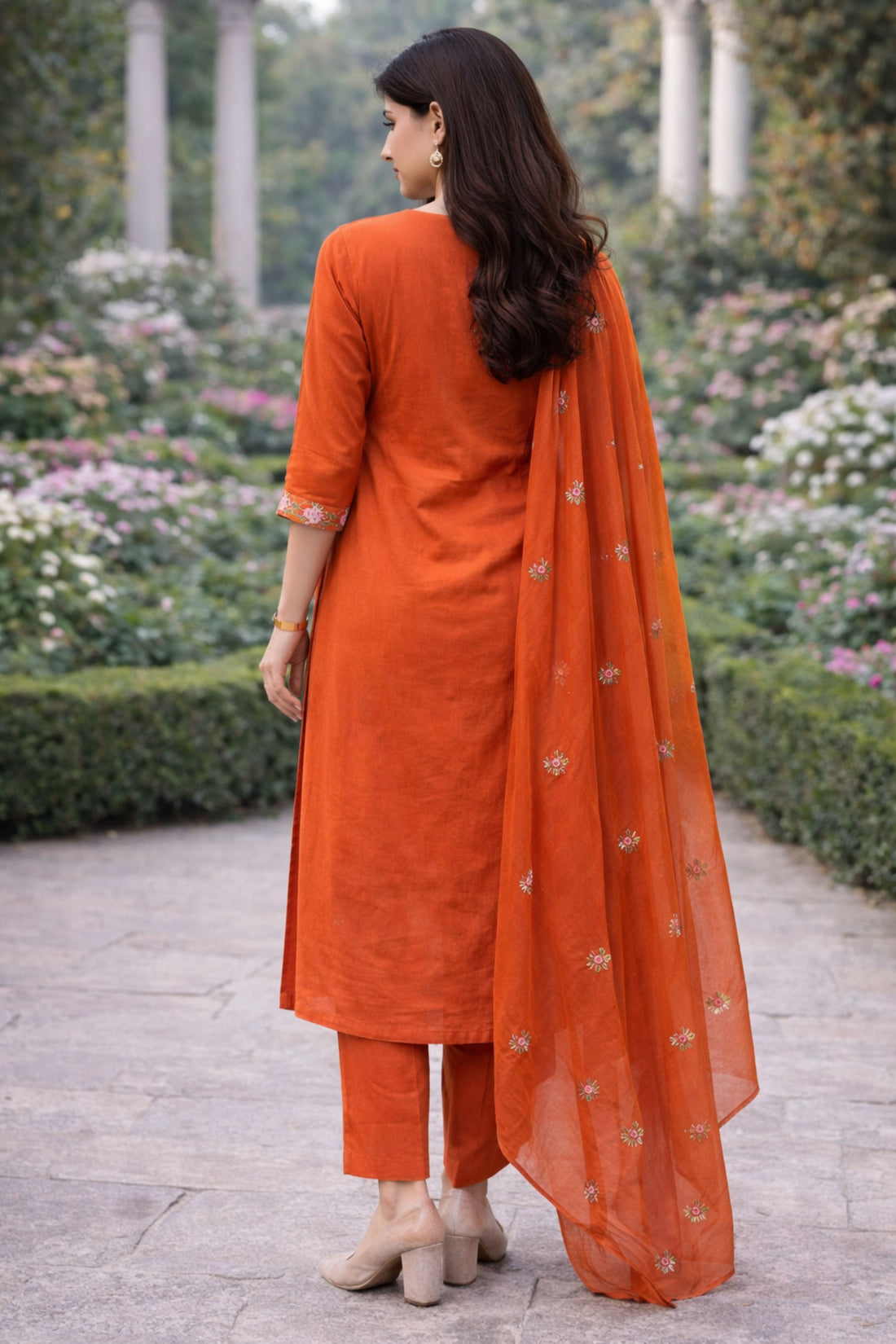 Rust floral embroidered three-piece suit set for women, featuring a jacket, pants, and top.