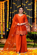 Elegant Orange Three-Piece Suit Set: A man wears a vibrant orange suit with a matching jacket, vest, and trousers, exuding