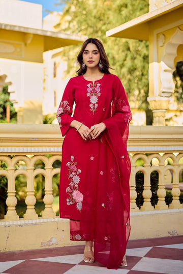 Magenta Bloom Floral Embroidered Suit Set on a mannequin, featuring intricate pink and green embroidery on a vibrant magenta