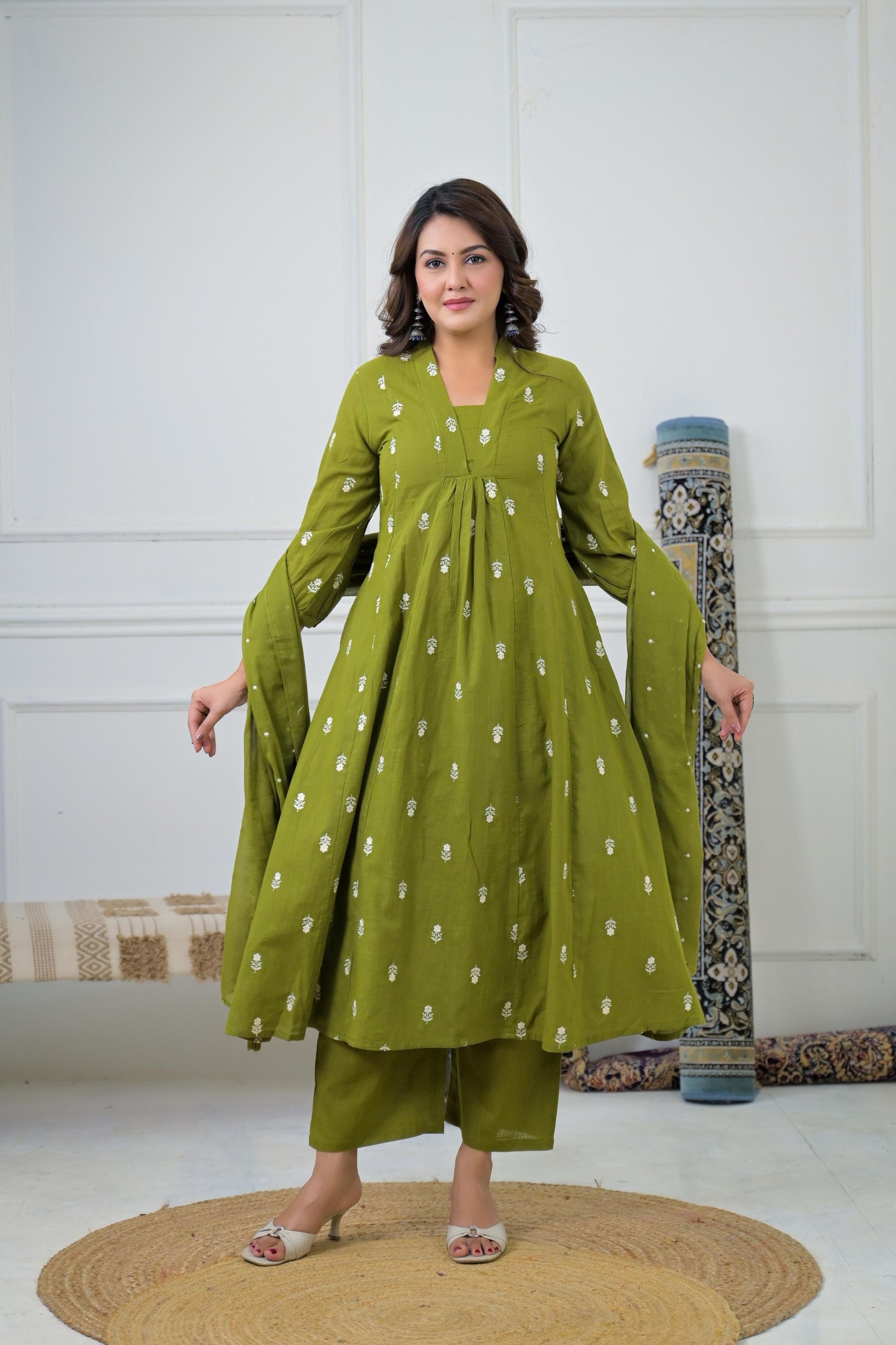 Green Floral Embroidered Suit Set featuring intricate green floral embroidery on a green fabric.