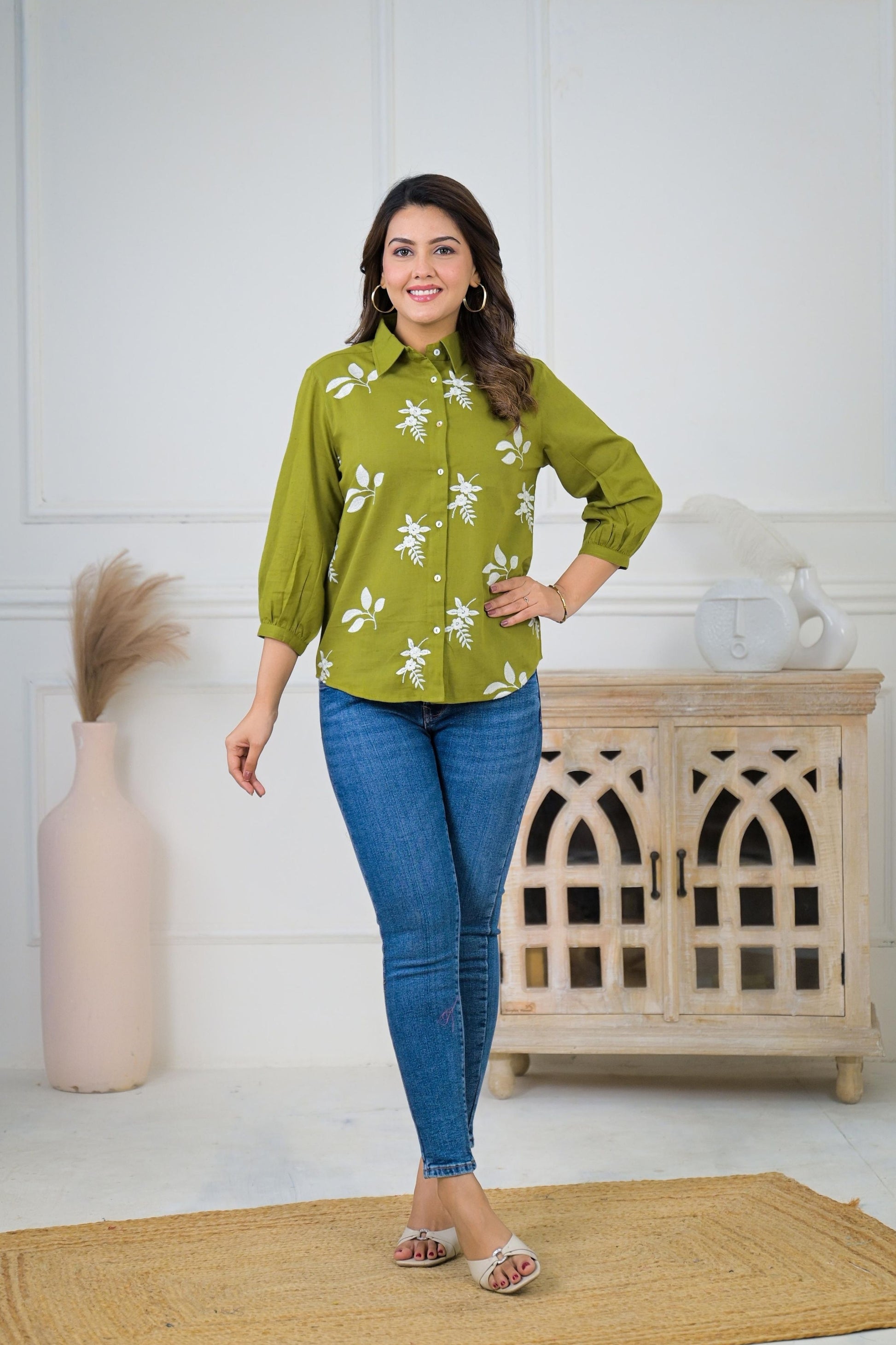 Floral embroidered button-down shirt for women, featuring delicate floral embroidery on a classic button-down silhouette.