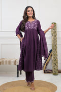 Embroidered kurta set with dupatta, featuring intricate floral embroidery on a vibrant fabric.