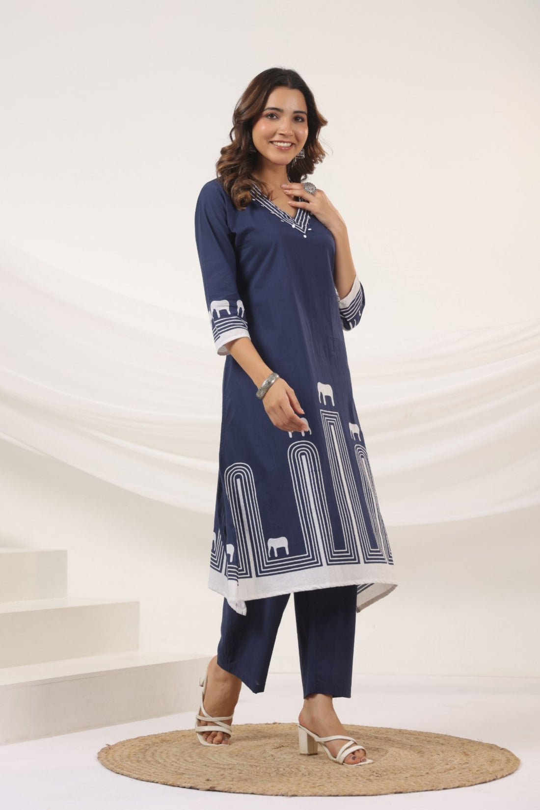 Elephant motif printed kurta set in white and blue, featuring an elephant design.