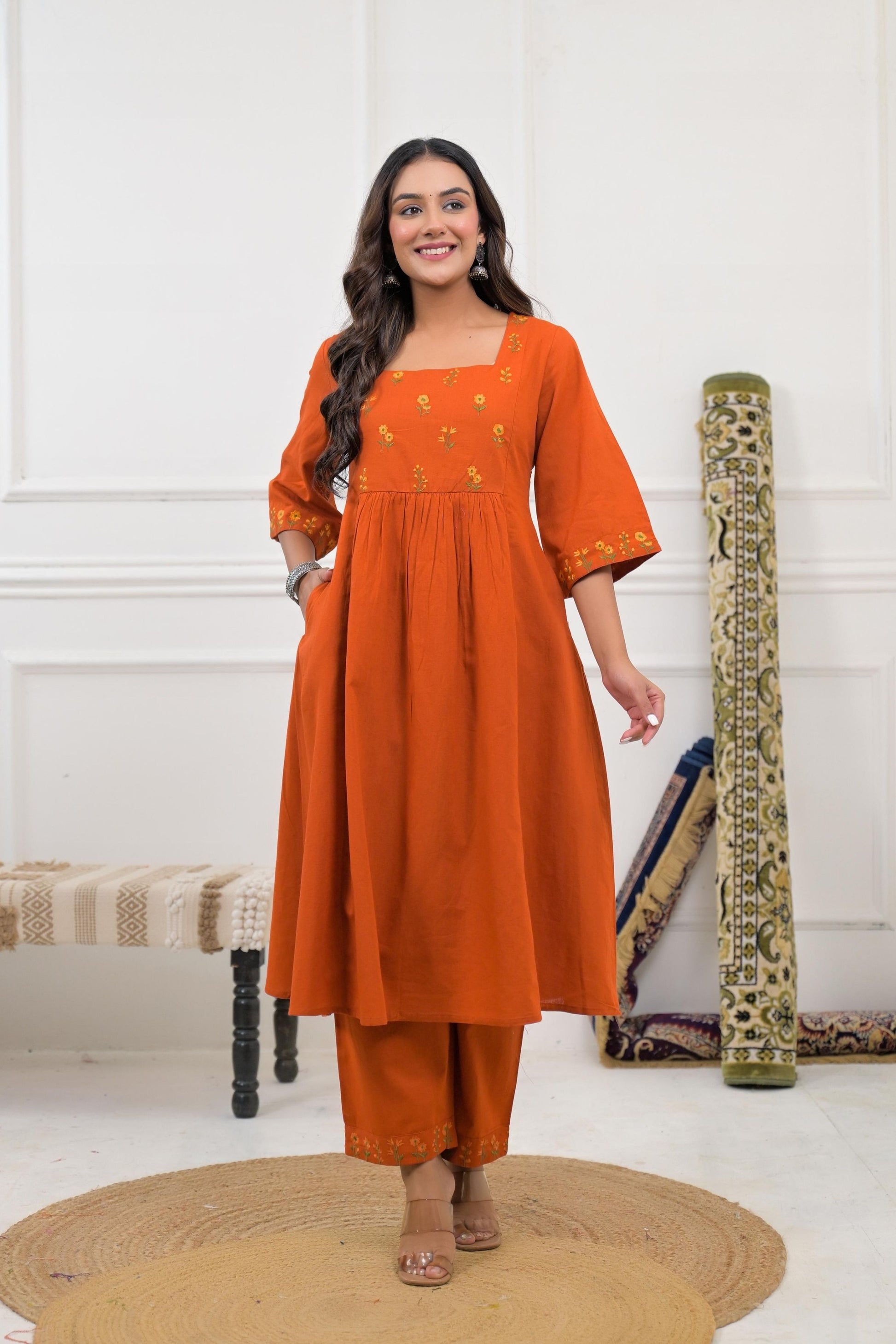 Rust floral embroidery kurta set with intricate stitching and subtle embellishments.