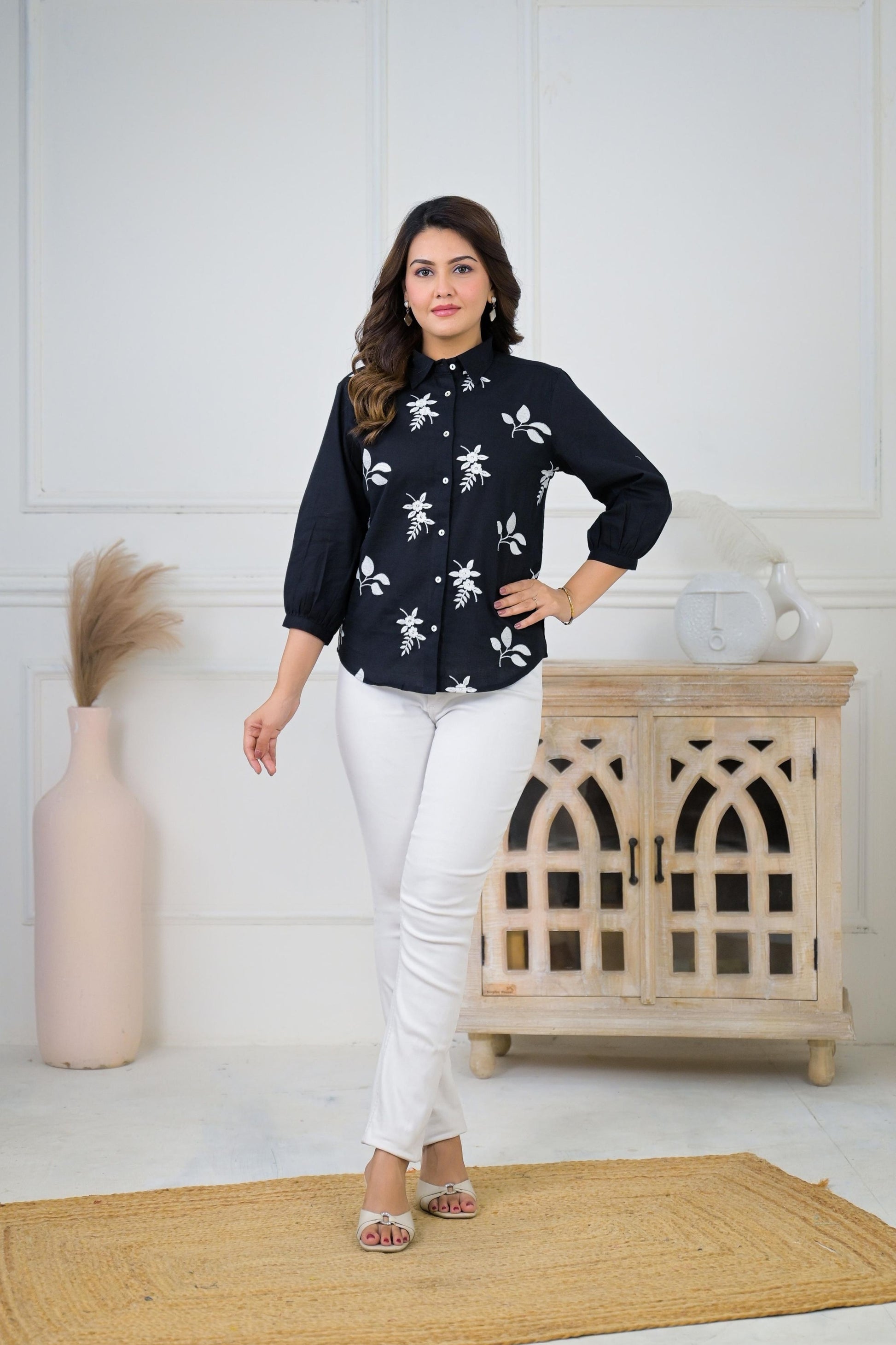 Floral embroidered button-down shirt for women, featuring intricate floral embroidery on a light-colored fabric.