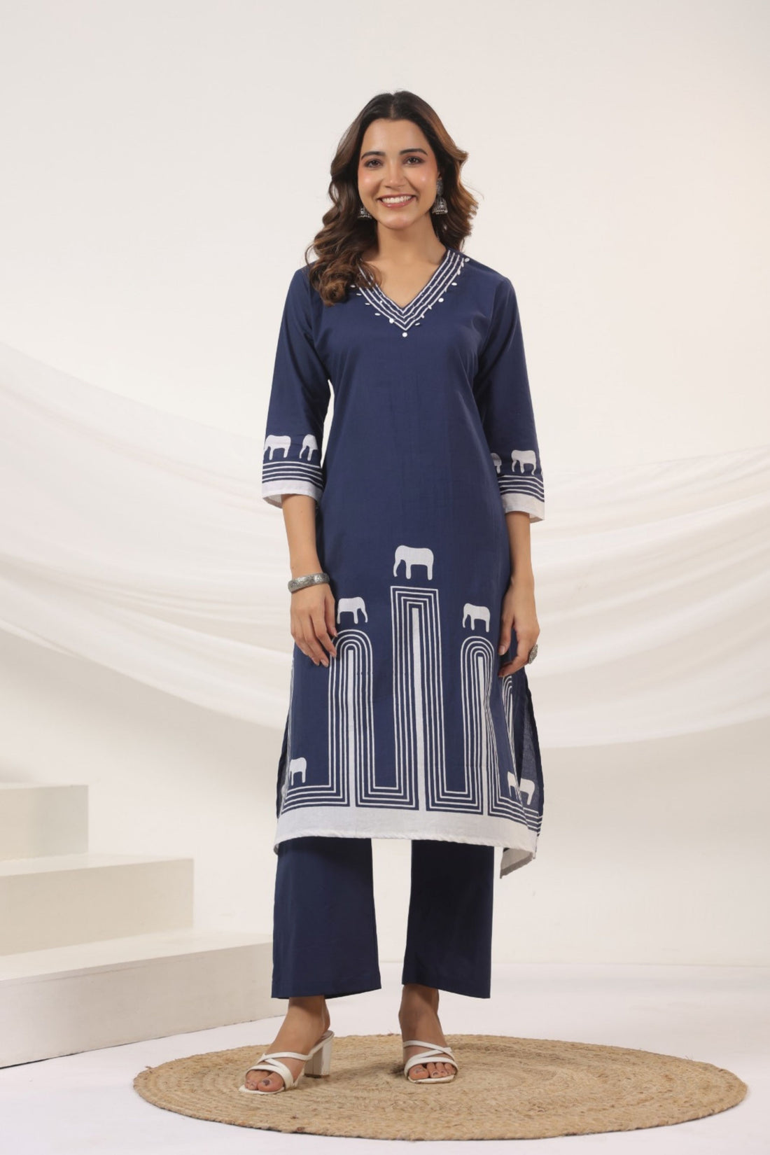 Elephant motif printed kurta set in white and blue, featuring an elephant design.